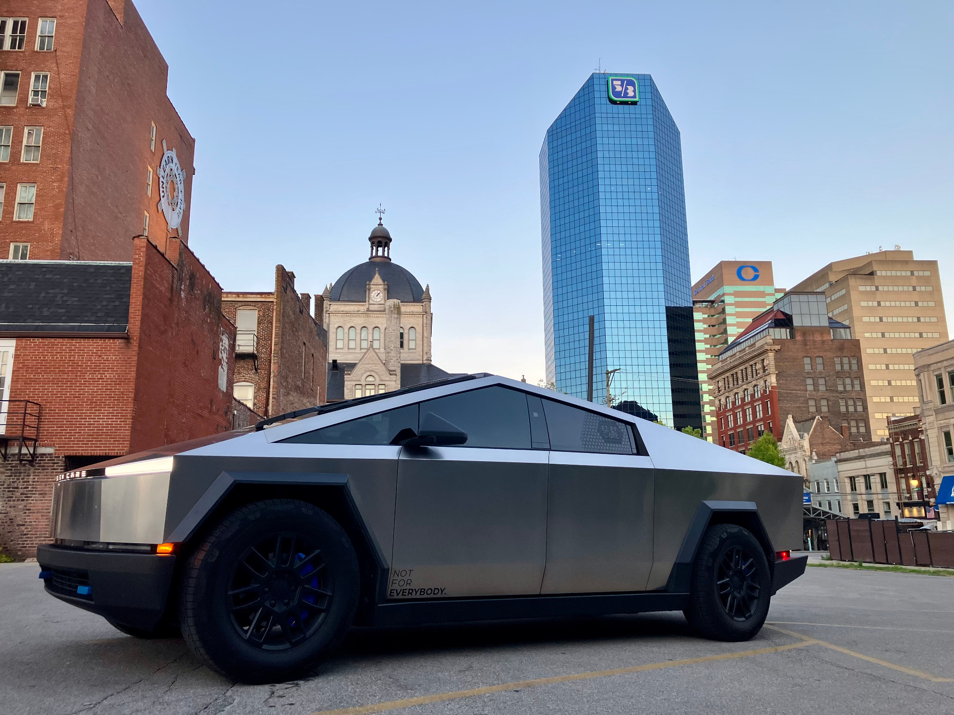 Tesla Cybertruck parked in downtown Lexington Kentucky with skyline